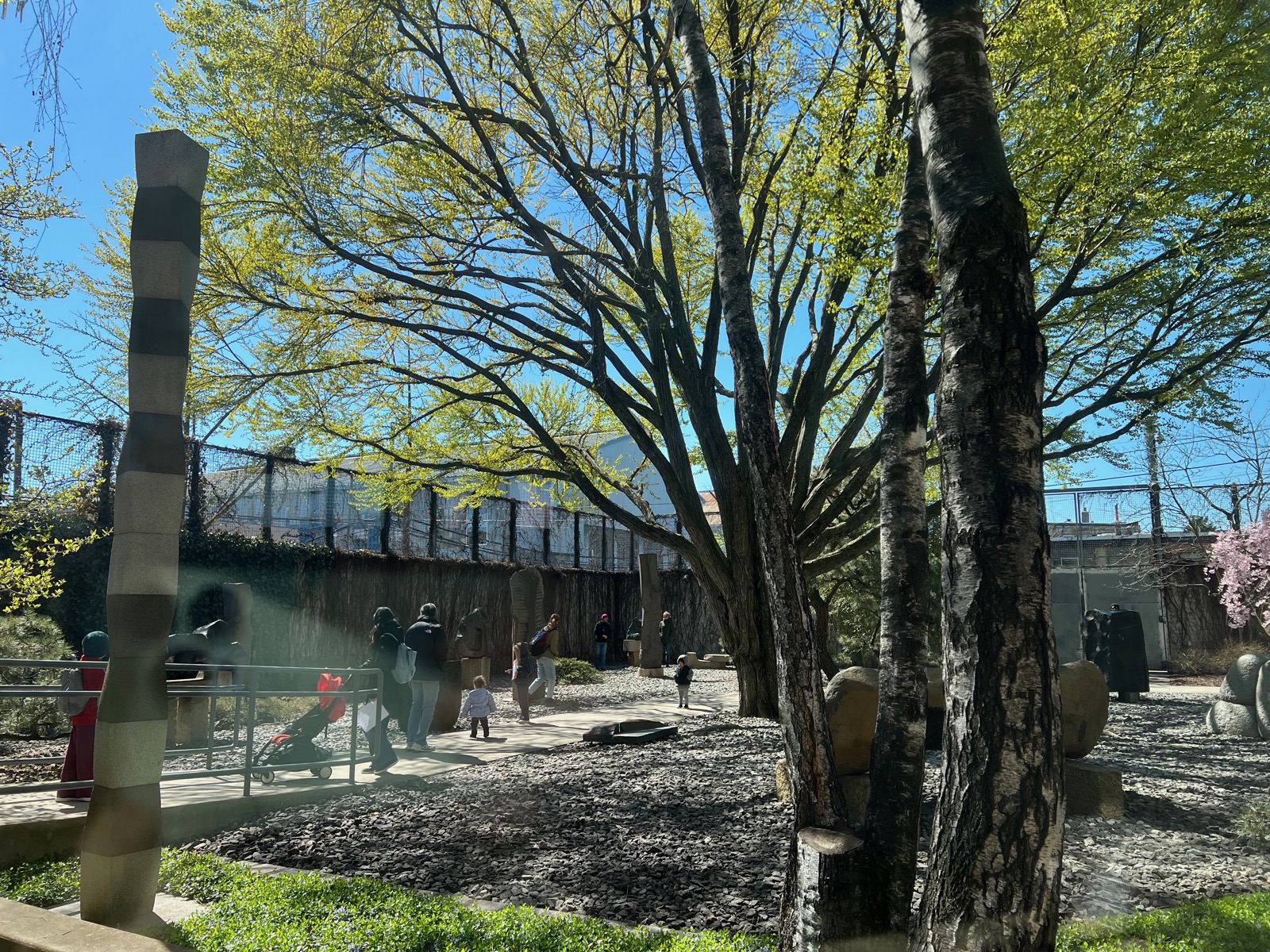 Families with strollers in the Noguchi garden