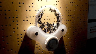 A user interacting with the kinetic randomness generator, its my friend dina