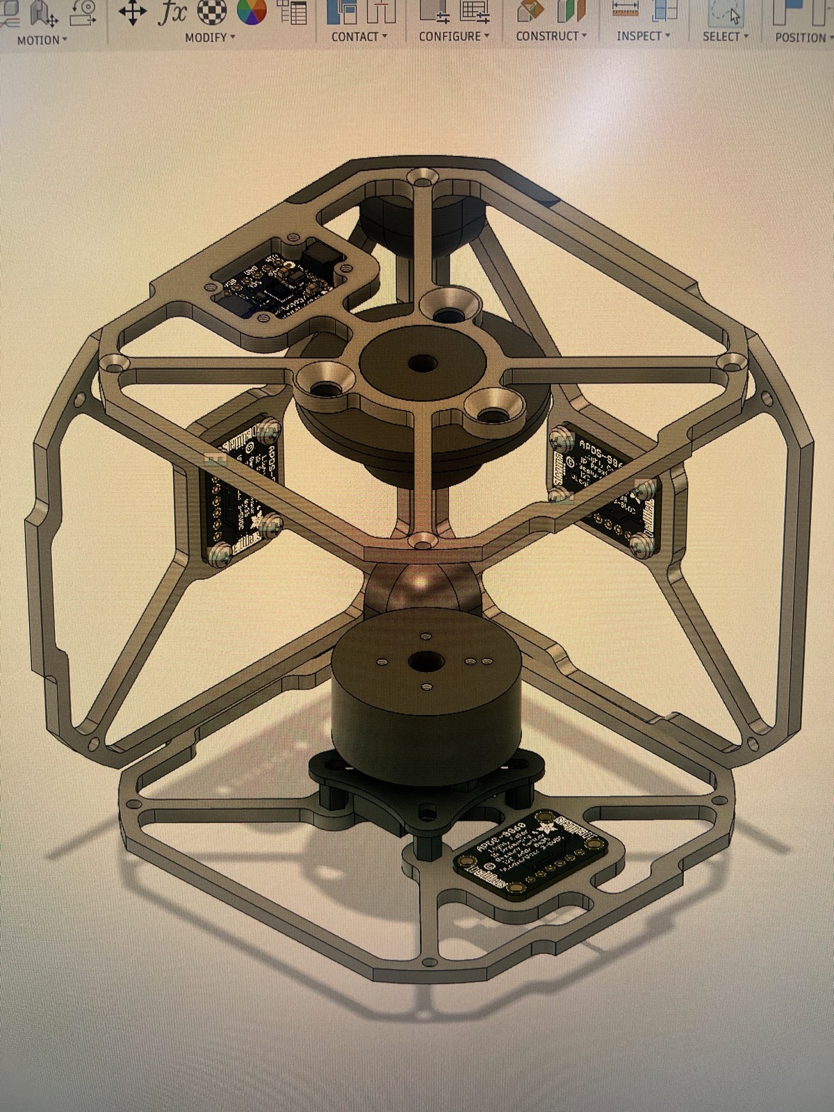 Fusion 360 render of the cube frame with a central motor and reaction wheel