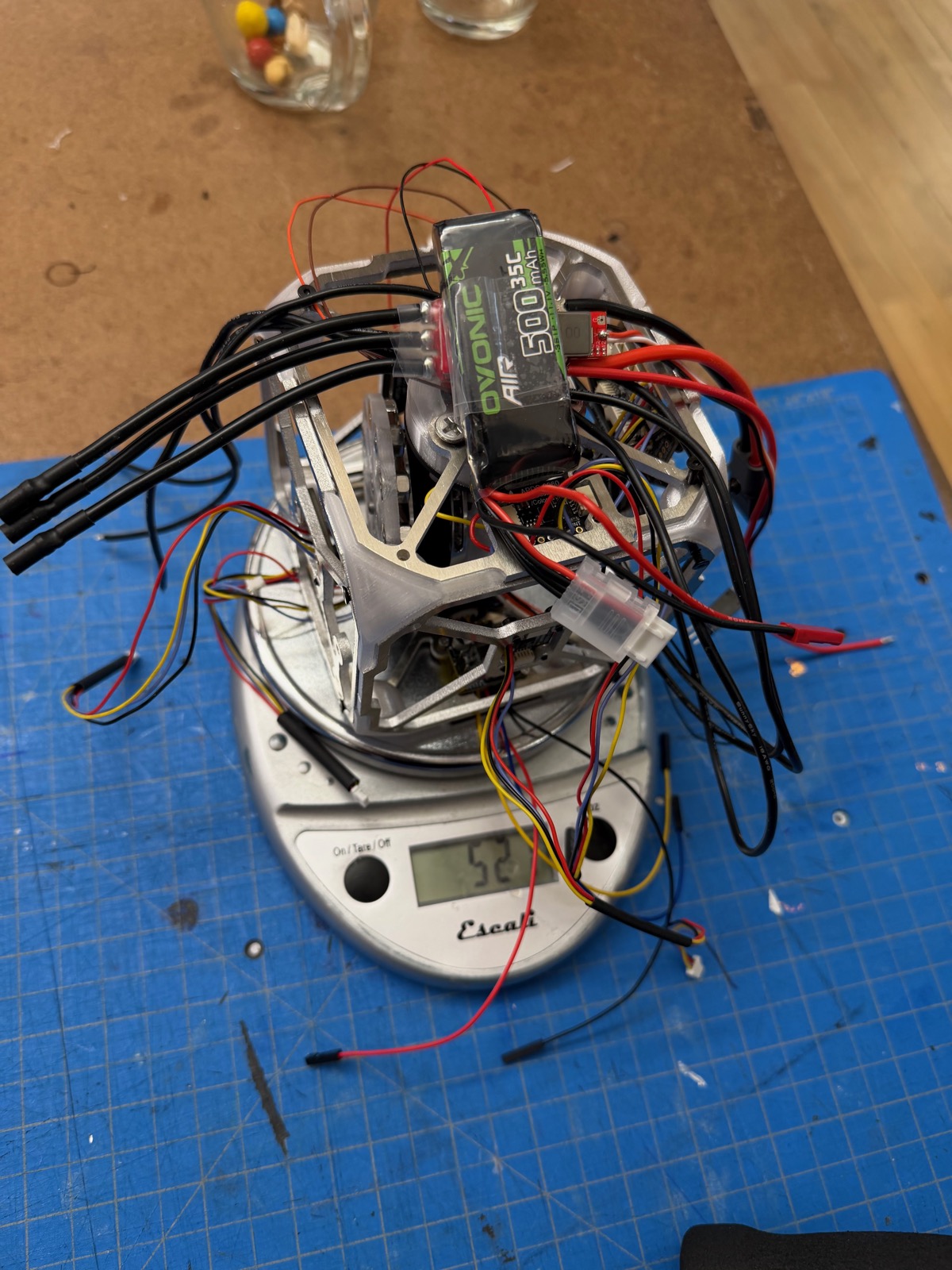 Assembled cube internals with an Ovonic LiPo battery on a scale