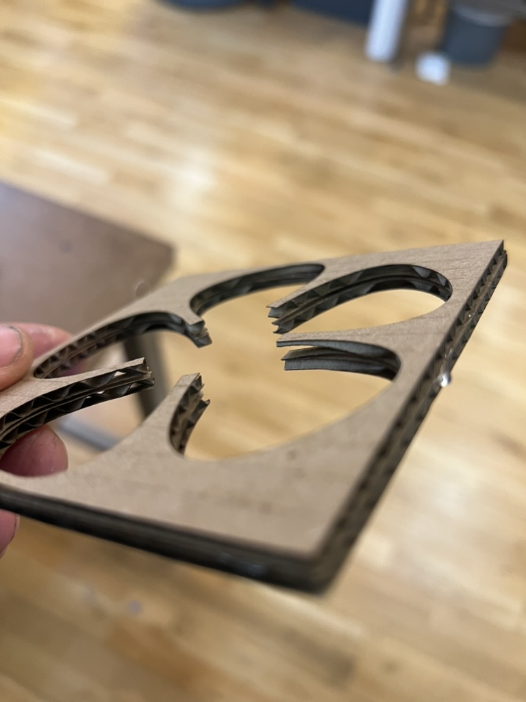 The cardboard mold still leaking through its holes