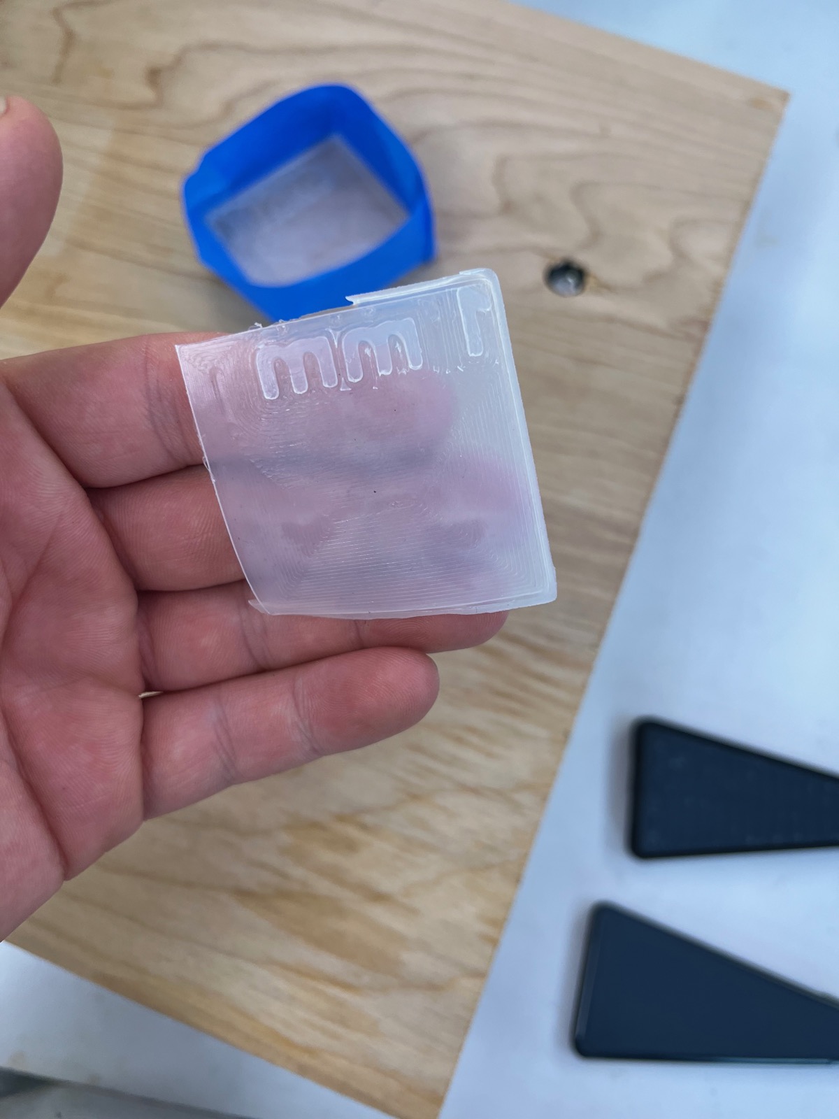 Cast silicone patch with pneumatic channels held in hand