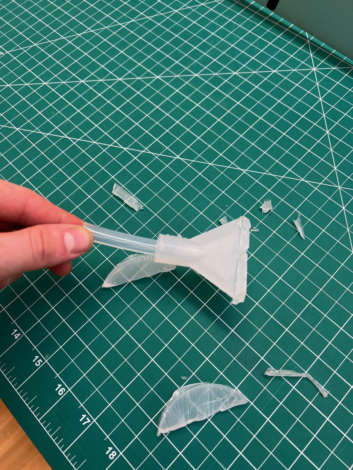 Hand-cut plastic funnel inflatable on a cutting mat