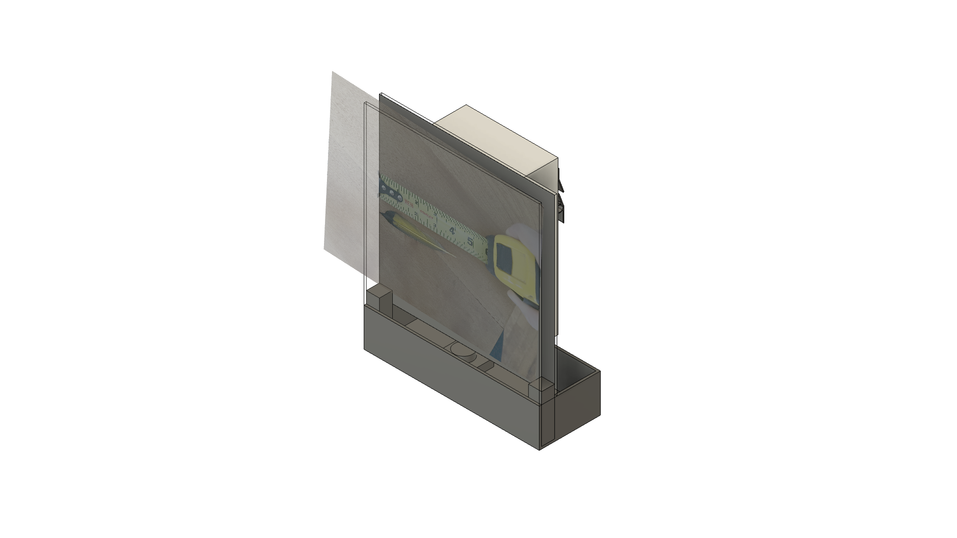 Fusion 360 massing model: a clear acrylic panel and a sheet of paper standing in front of a box, set into a long base tray, with a photo of a tape measure on the panel for scale.