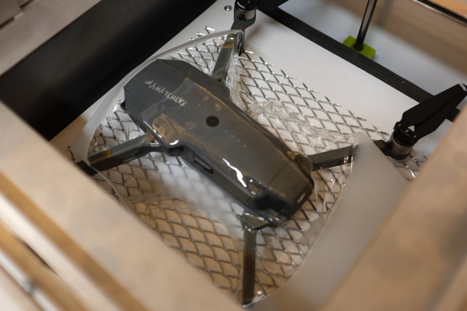 Drone in wire mesh cage during testing