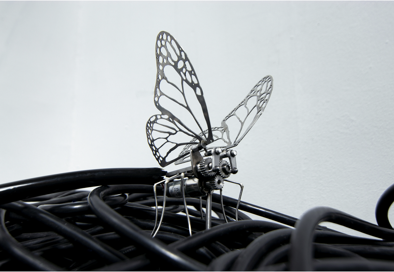 Finished stainless steel kinetic butterfly sculpture